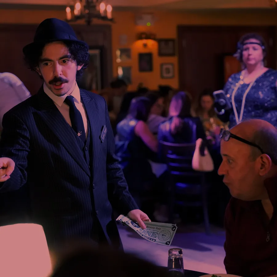 A Murder Mystery Company actor working the room at a Baltimore show