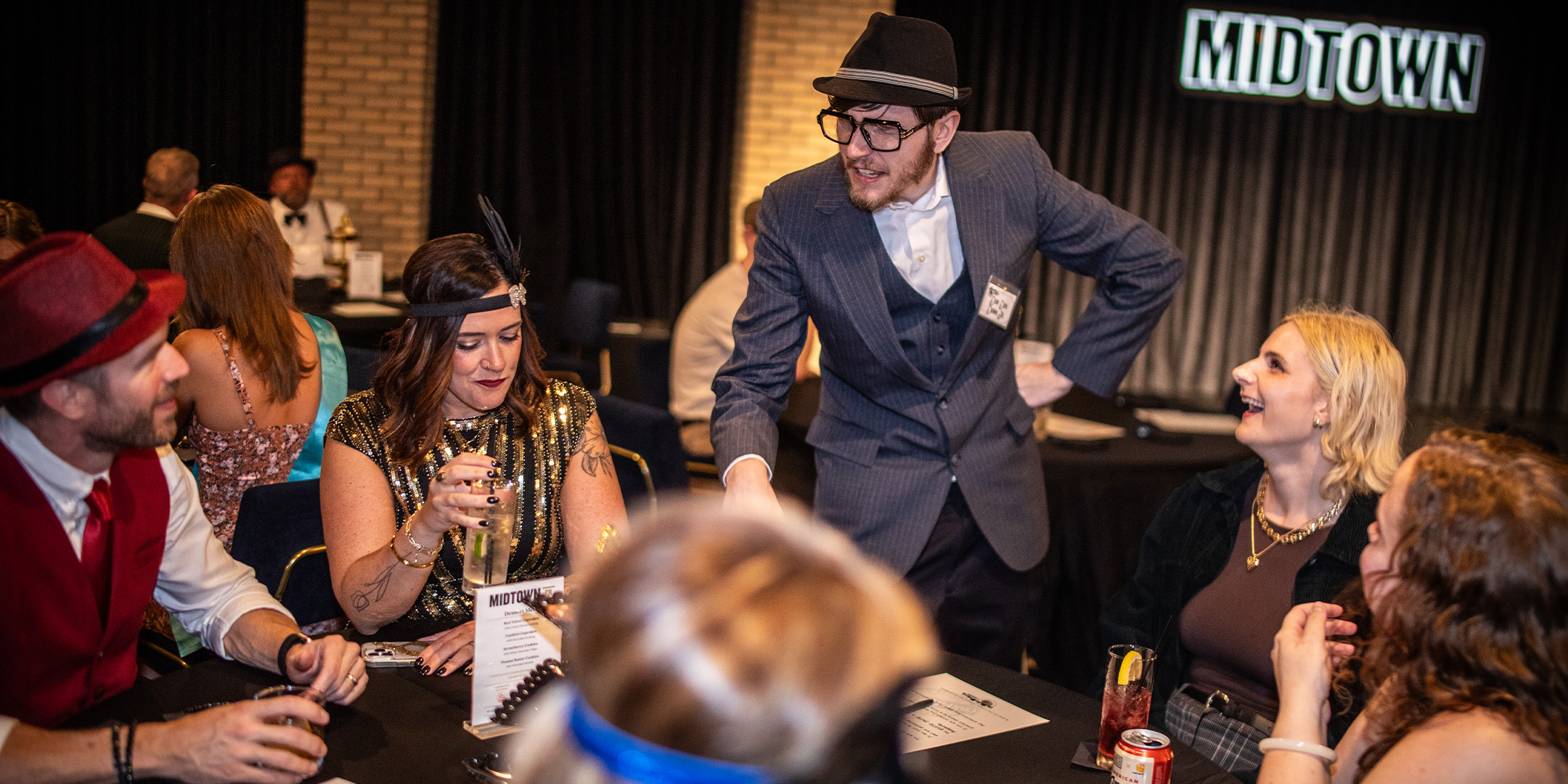 Guests at a Murder Mystery Company public dinner show in Baltimore