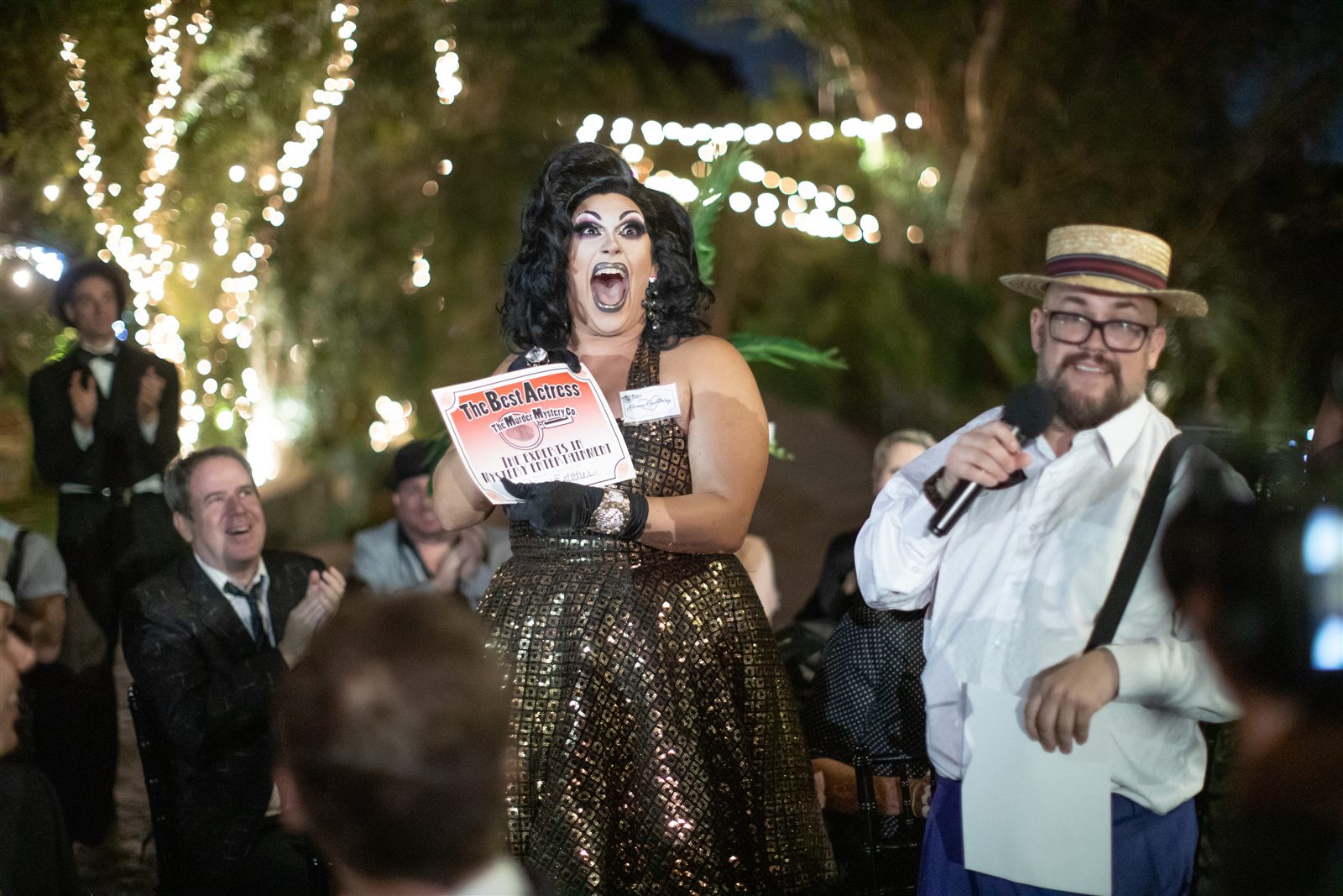 Guests investigating at a Murder Mystery Company dinner show